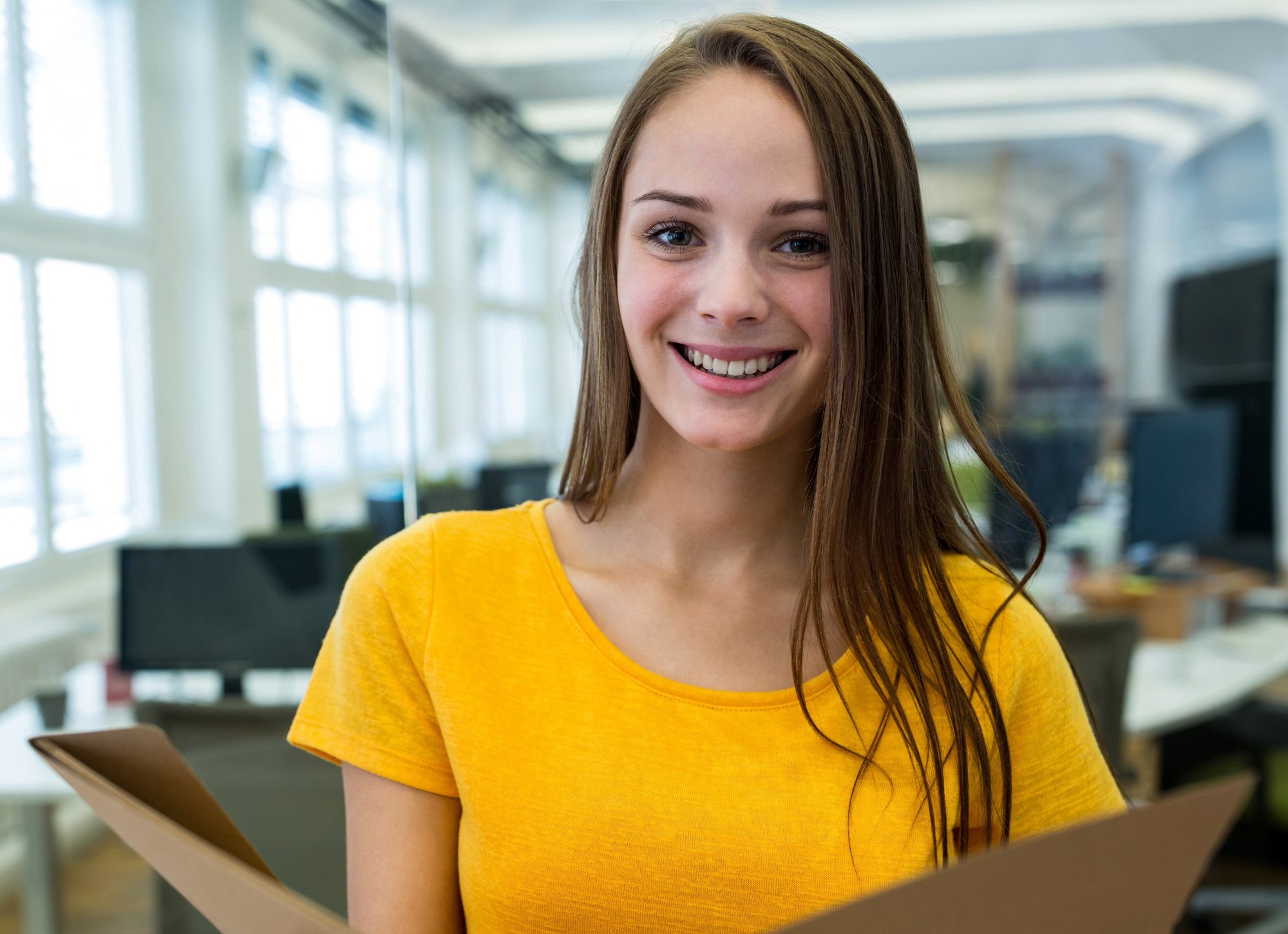 portrait-female-business-executive-holding-file-2